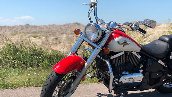A group of motorcyclist making their way down a twisty mountain road