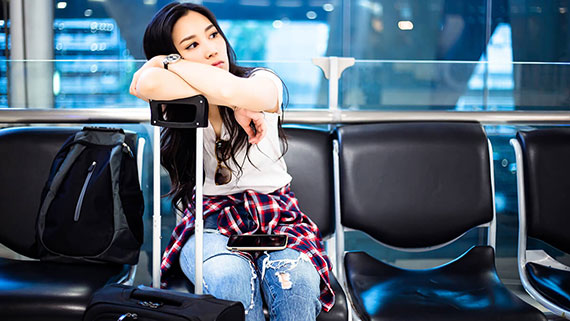 An airplane taxiing on runway during a snow storm