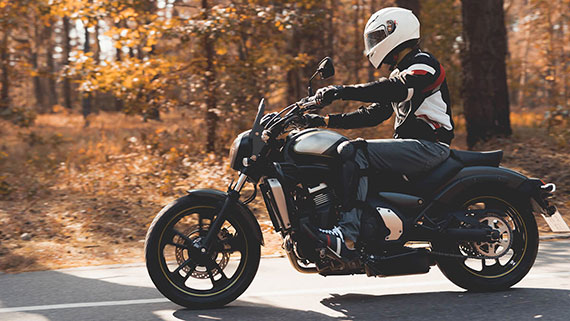 A motorcycle riding through a scenic highway