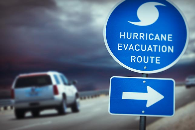 A hurricane evacuation route highway sign