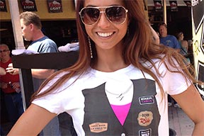 A smiling woman biker with sunglasses