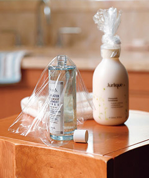 Tolietries with plastic wrap between bottle and cap